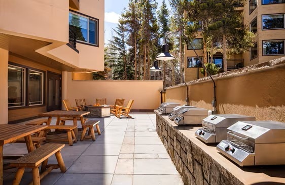 view of patio / terrace featuring a grill, area for grilling, and an outdoor fire pit