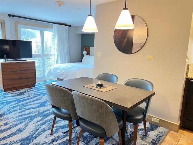 dining area featuring light tile patterned floors