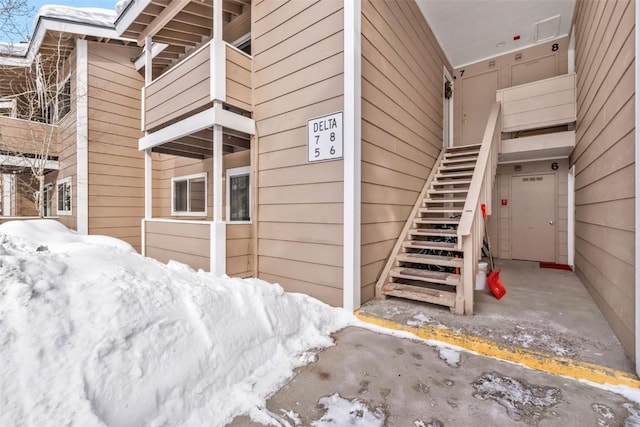 view of snow covered property entrance