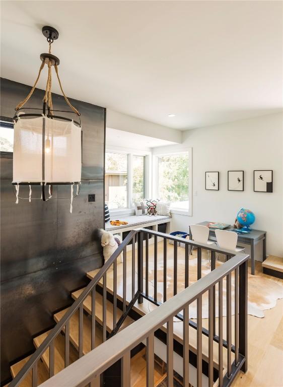 stairs featuring wood finished floors