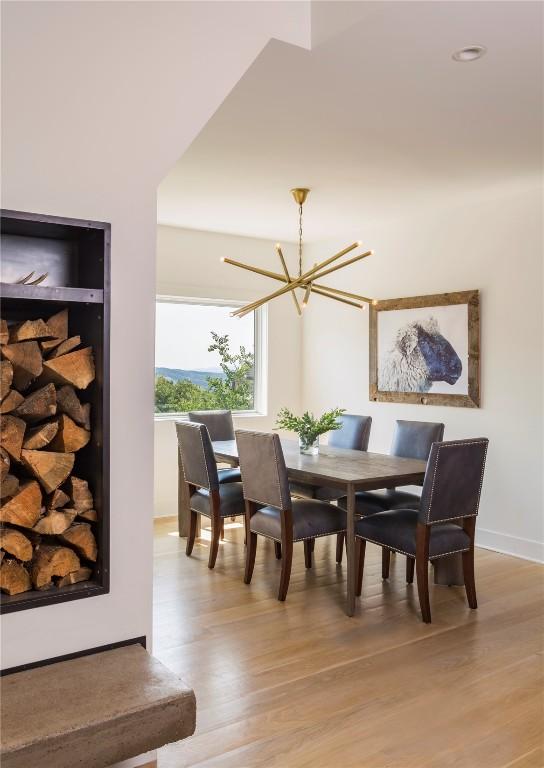 dining room featuring light hardwood / wood-style floors and an inviting chandelier