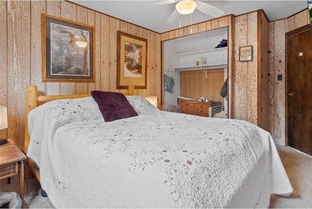 bedroom featuring a closet, ceiling fan, and carpet