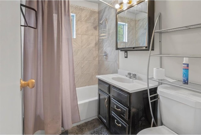 full bathroom featuring toilet, shower / bath combo with shower curtain, and vanity