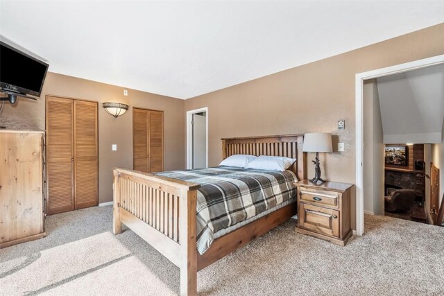 carpeted home office with wood ceiling