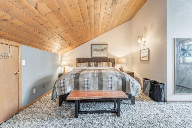 bedroom featuring lofted ceiling, carpet floors, and wooden ceiling