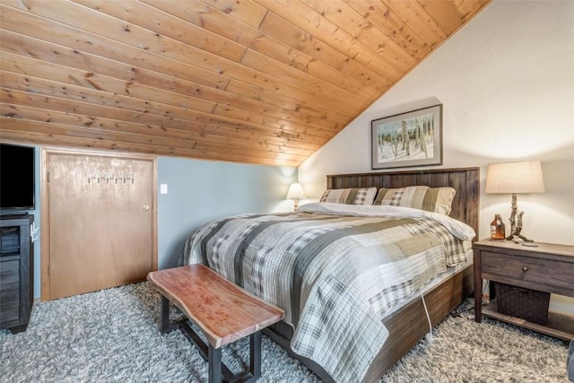 carpeted bedroom featuring vaulted ceiling and wood ceiling