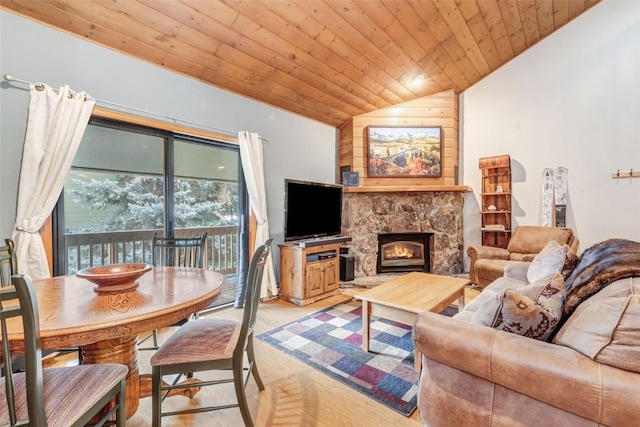 living room with a stone fireplace, wooden ceiling, light wood-type flooring, and vaulted ceiling