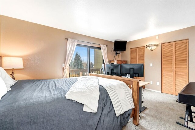 bedroom with refrigerator, access to exterior, and carpet floors