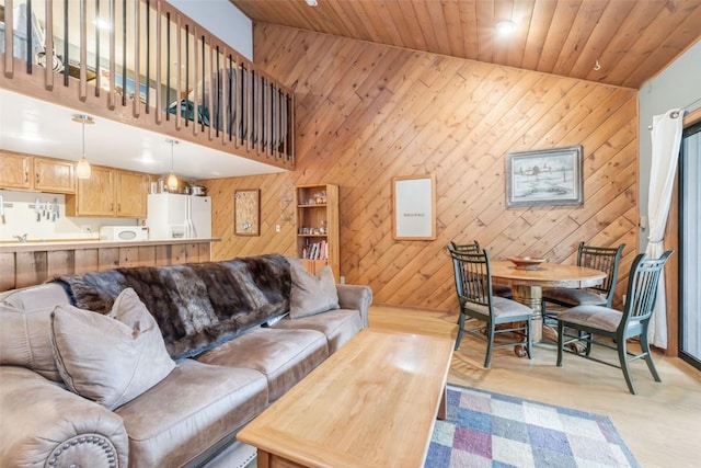 living room with light wood-type flooring and wood ceiling