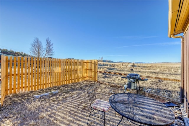 view of patio / terrace featuring area for grilling and fence