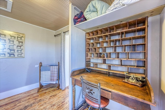 office area with wood finished floors and baseboards