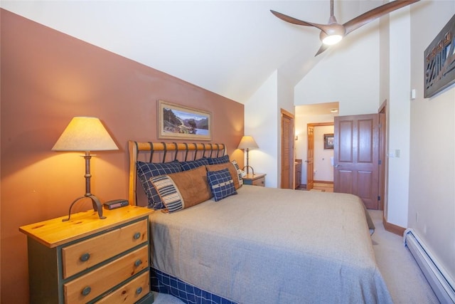 bedroom with lofted ceiling, ceiling fan, ensuite bathroom, carpet floors, and a baseboard radiator