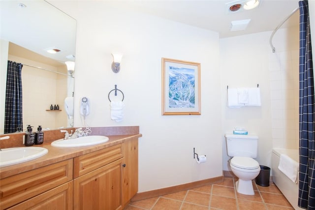 full bathroom with vanity, shower / tub combo, tile patterned floors, and toilet