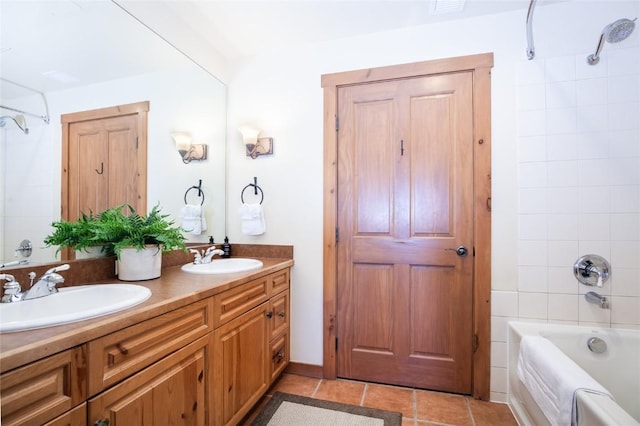 bathroom with shower / bathing tub combination, vanity, and tile patterned floors