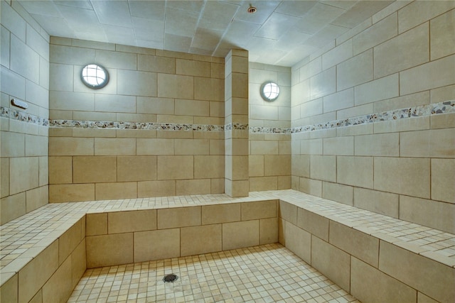 bathroom with tiled shower