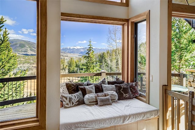 sunroom / solarium with a mountain view