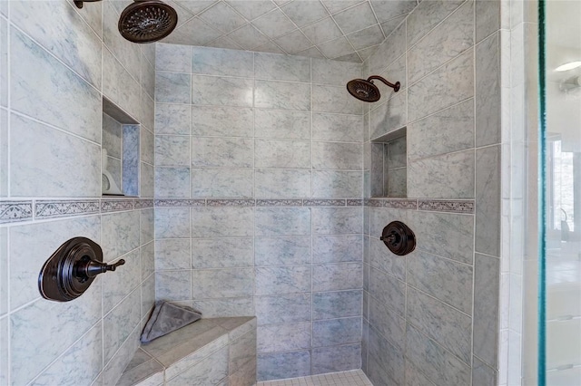 bathroom featuring a tile shower