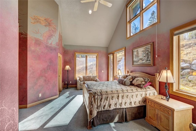 carpeted bedroom with ceiling fan, high vaulted ceiling, and multiple windows