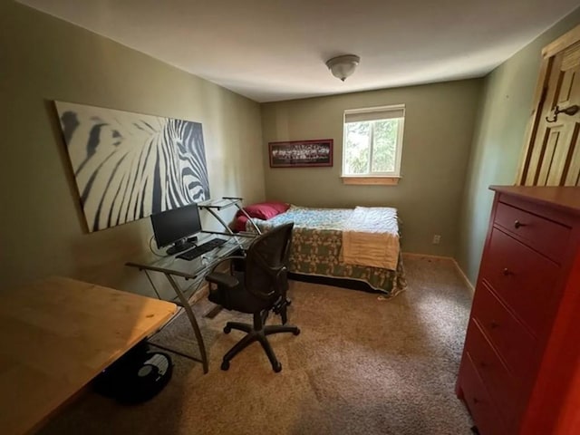 carpeted bedroom with baseboards