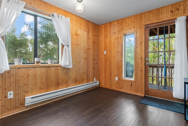 doorway to outside with a baseboard radiator and dark wood-type flooring