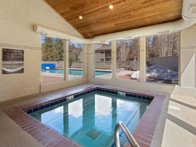 view of pool with an indoor in ground hot tub