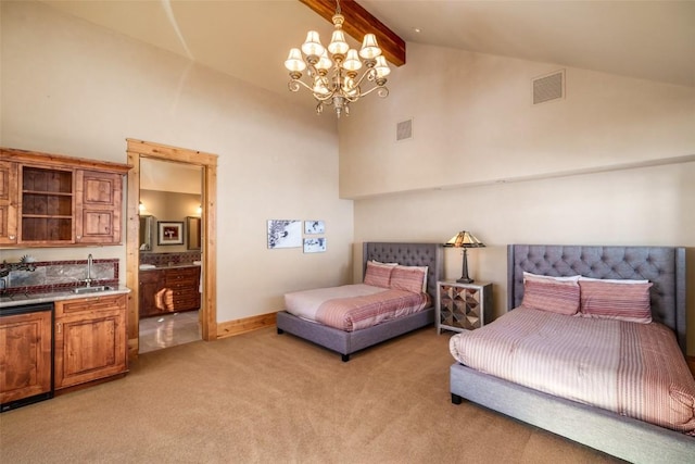 carpeted bedroom with a notable chandelier, beamed ceiling, sink, high vaulted ceiling, and connected bathroom