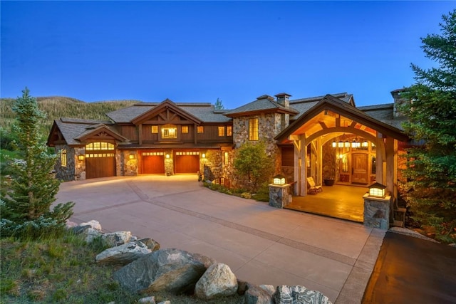 view of front facade featuring a garage and a mountain view