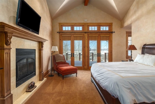 carpeted bedroom with a tile fireplace, french doors, high vaulted ceiling, beam ceiling, and access to exterior