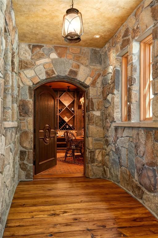 wine cellar with wood-type flooring