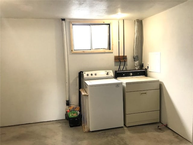 laundry room featuring laundry area and separate washer and dryer