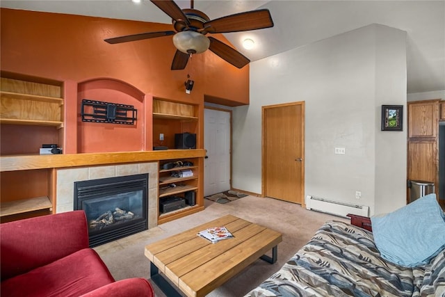 living area with ceiling fan, carpet floors, baseboard heating, a tile fireplace, and a high ceiling