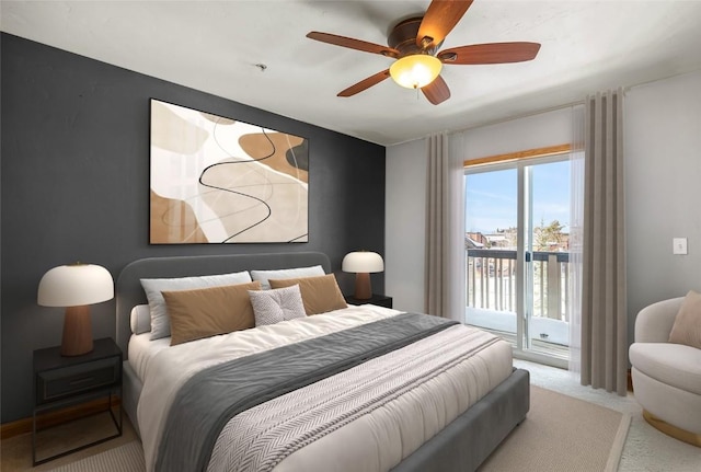 carpeted bedroom featuring access to exterior and ceiling fan