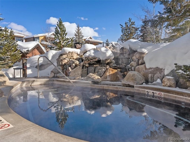 view of snow covered pool