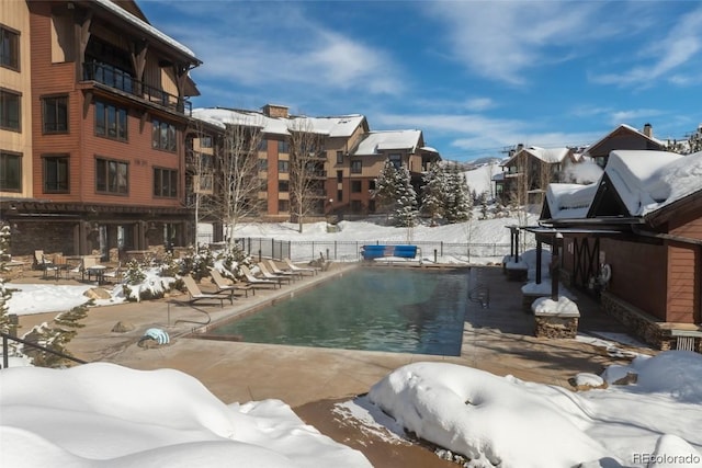 view of snow covered pool