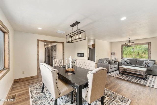 dining room with hardwood / wood-style floors