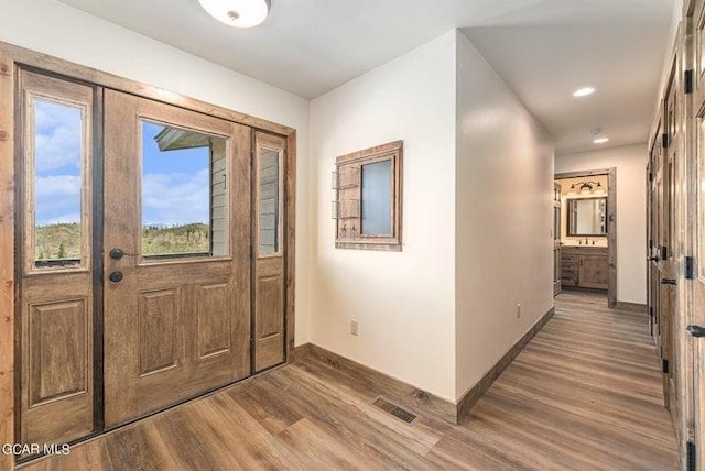 foyer entrance with hardwood / wood-style flooring