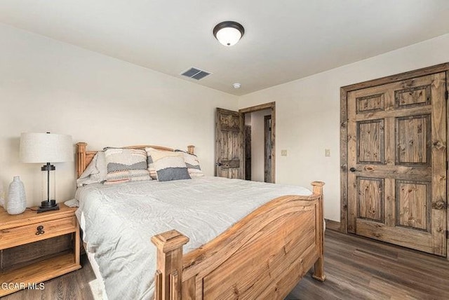 bedroom featuring dark wood-type flooring