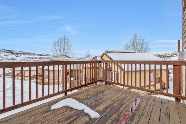 view of snow covered deck