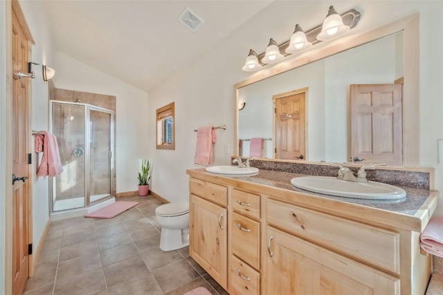 bathroom with vaulted ceiling, toilet, vanity, and walk in shower