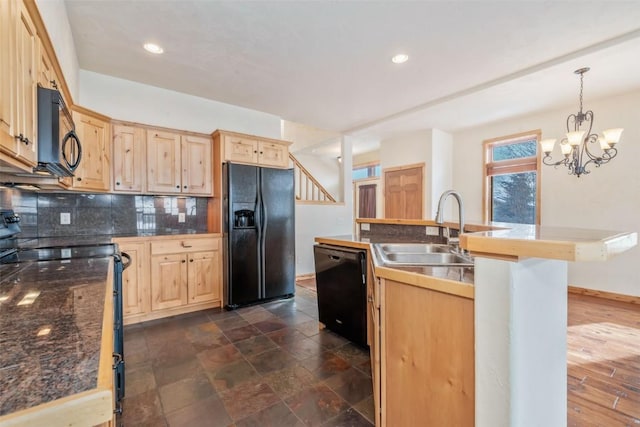 kitchen featuring pendant lighting, sink, light brown cabinets, and black appliances