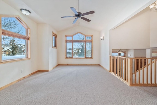 interior space featuring ceiling fan, lofted ceiling, and carpet flooring