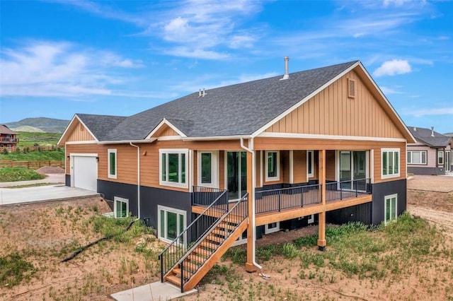 view of front of house featuring covered porch, concrete driveway, roof with shingles, and an attached garage