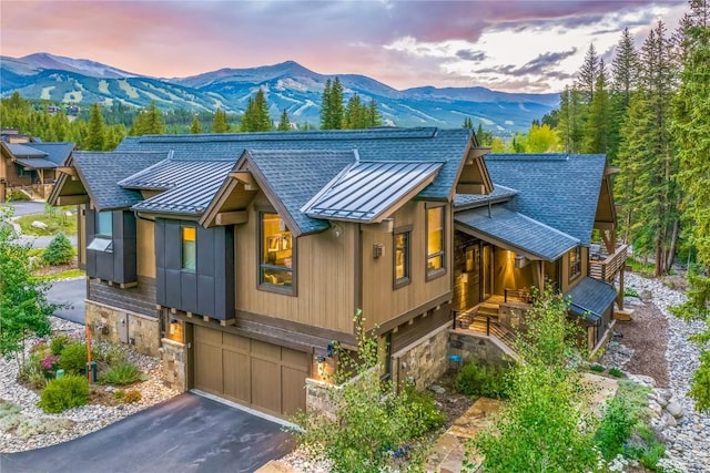 view of front facade with a mountain view and a garage