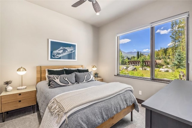 bedroom with ceiling fan and carpet floors