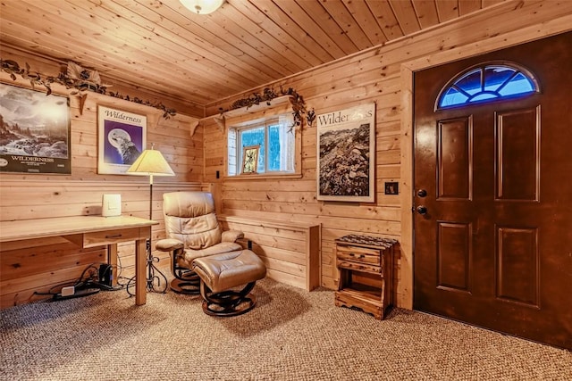 living area featuring carpet floors, wood ceiling, and wooden walls