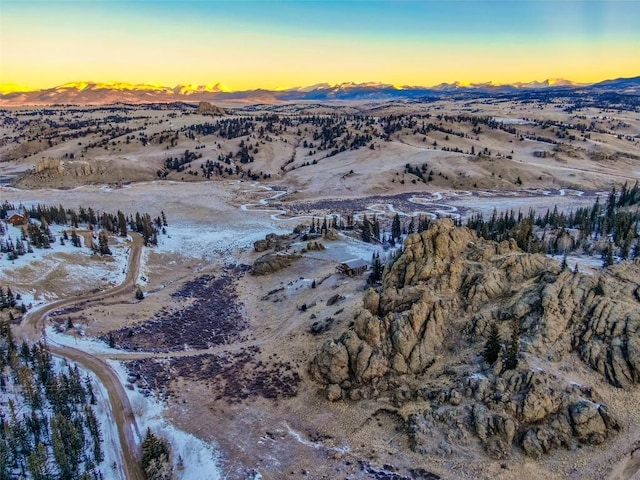 birds eye view of property featuring a mountain view