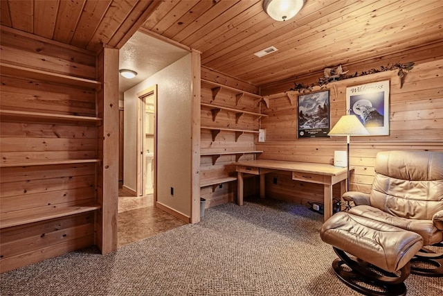 living area featuring carpet floors, wood walls, wooden ceiling, and visible vents