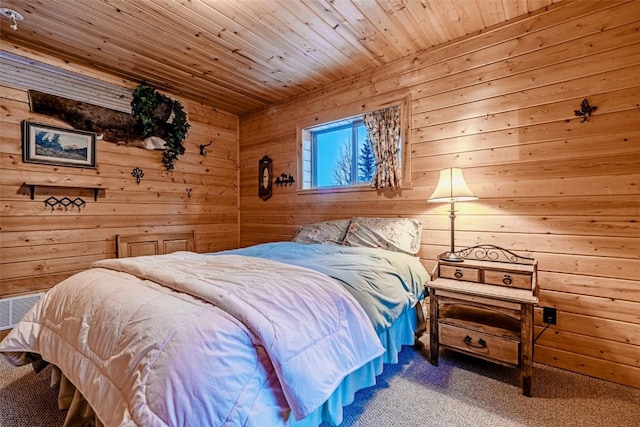 carpeted bedroom featuring wood ceiling and wooden walls