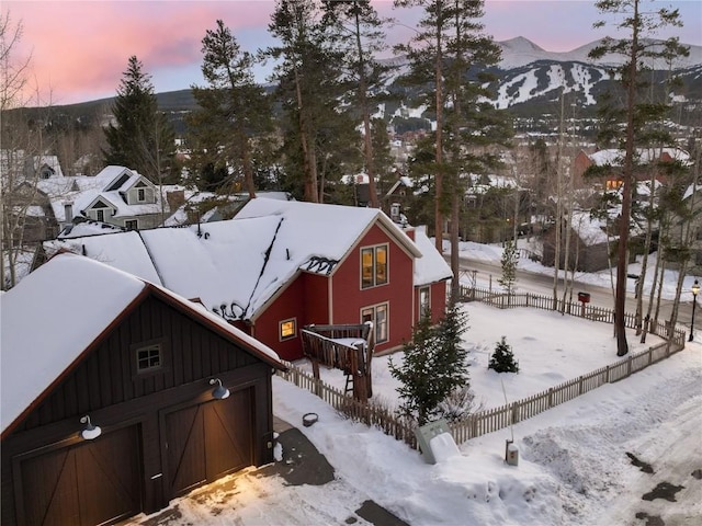 exterior space with a mountain view and an outbuilding