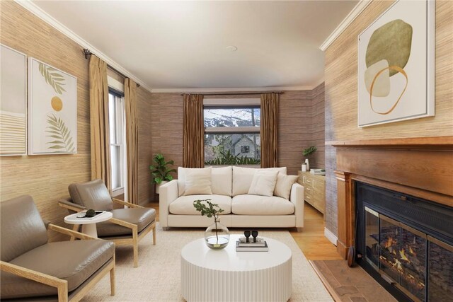 interior space with ornamental molding and light hardwood / wood-style flooring